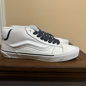 Vans White and Black High-Top Sneakers